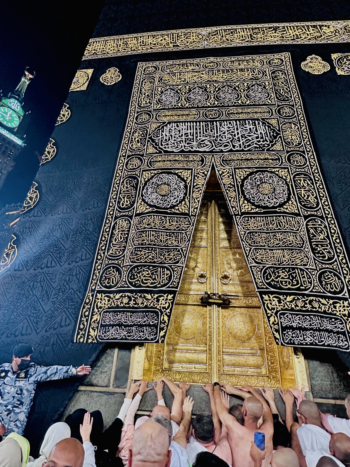 The golden door of the Kaaba, its embroidered black covering rich with gold calligraphy