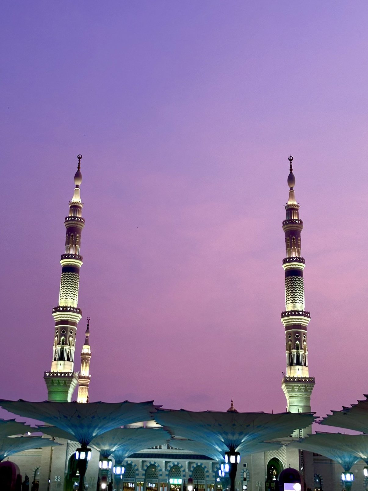 Twilight over the Prophet's Mosque, minarets against a violet sky