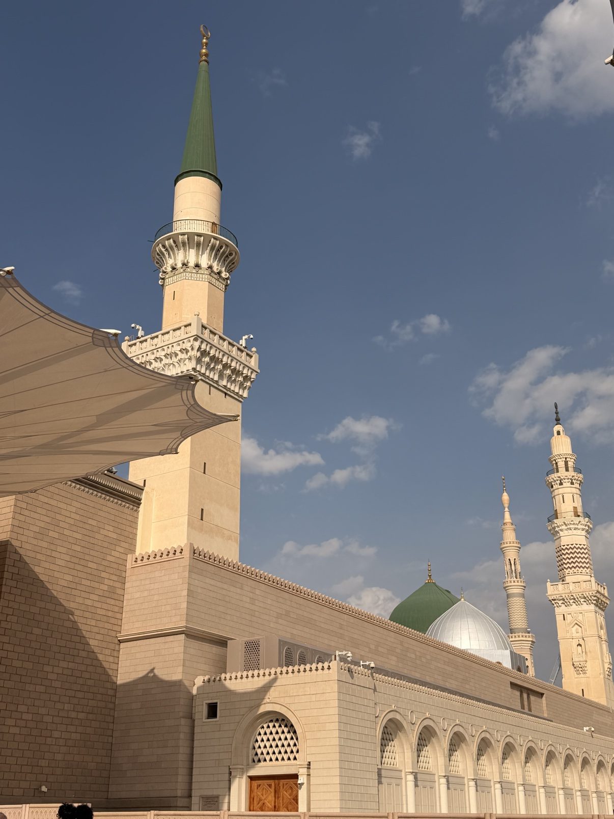 The Prophet's Mosque by day, minaret and courtyard umbrellas