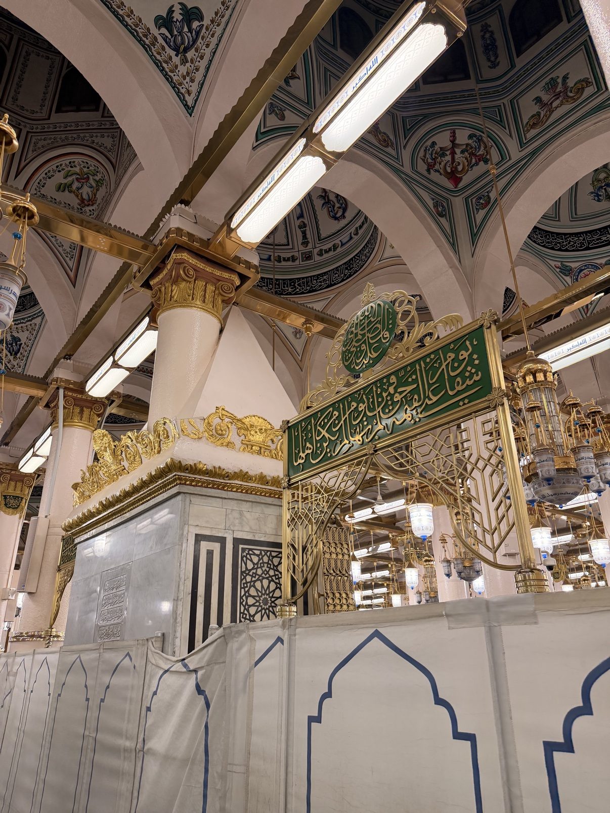 Ornamented walls and gilded columns inside the Prophet's Mosque near the Rawdah