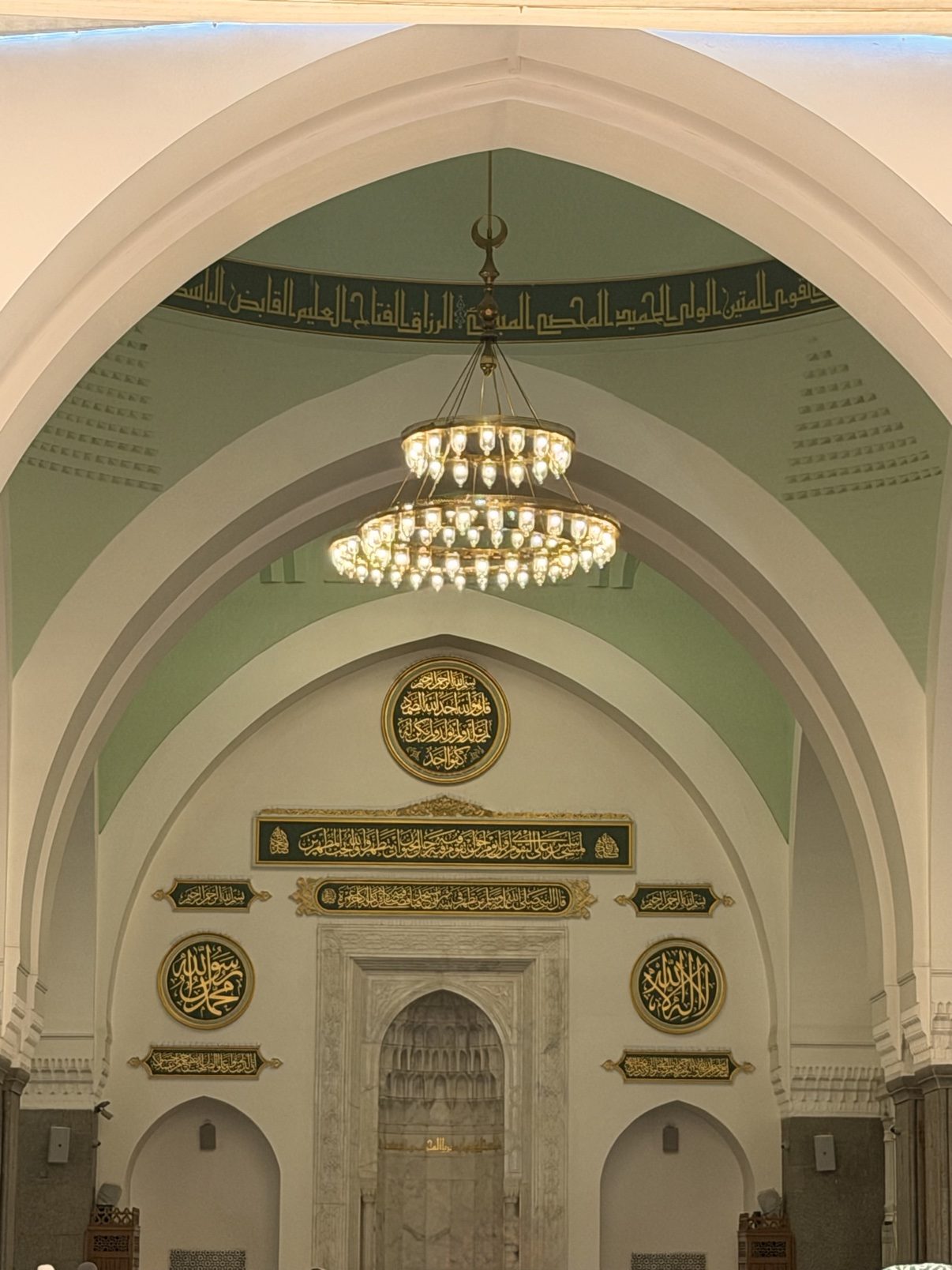 Arches and chandeliers in the prayer hall of the Prophet's Mosque