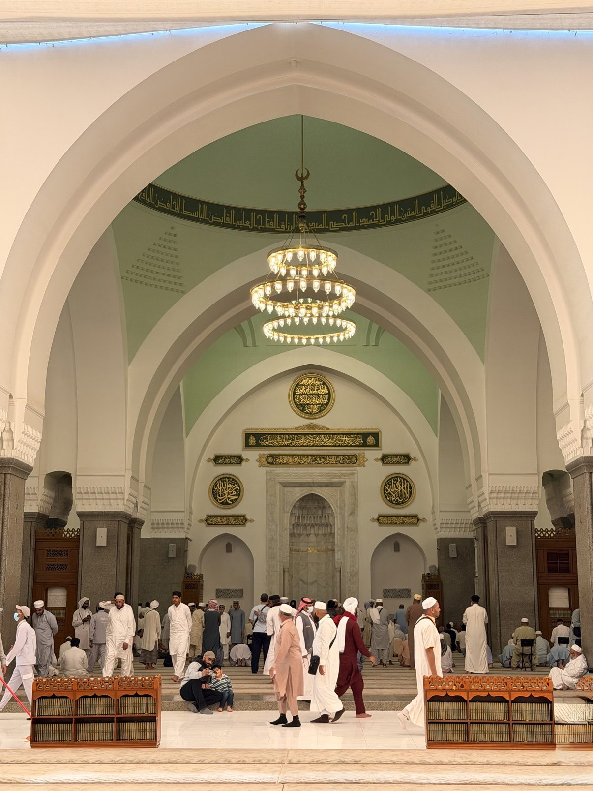 The prayer hall of the Prophet's Mosque, rows of arches under soft light