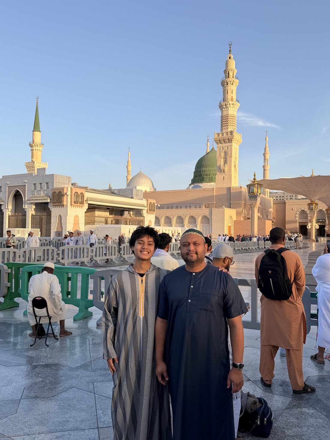 Two members of the group in the courtyard of the Prophet's Mosque with the Green Dome behind them